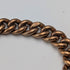 Antique British rolled gold double Albert chain with brass key fob